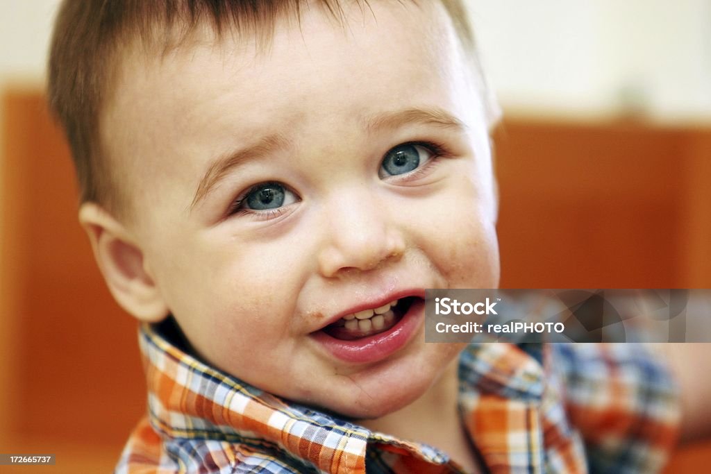 child not sure if he should smile or cry Family Stock Photo