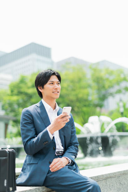 istock Young businessman checking his smartphone in the park 1726660102