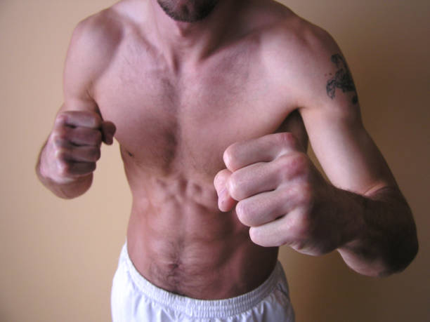 Fighter "Fighter.If Youaare looking for that kind of photos, please, look at my" chest tattoo pain stock pictures, royalty-free photos & images