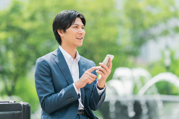 istock Young businessman checking his smartphone in the park 1726660617