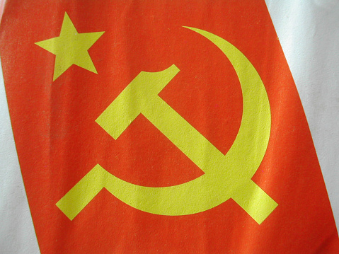 yellow communist symbol on red background