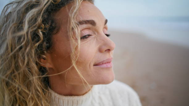 istock Romantic woman posing beach on autumn weekend closeup. Smiling curly model enjoy 1726665683