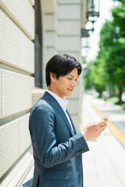 istock Young businessman checking his smartphone by the building 1726666202
