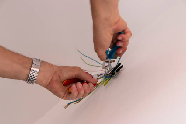 istock Electrician examining wires in building site 1726667236