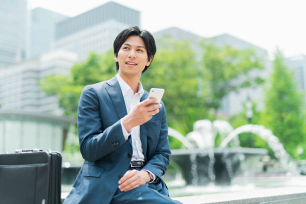 istock Young businessman checking his smartphone in the park 1726667248