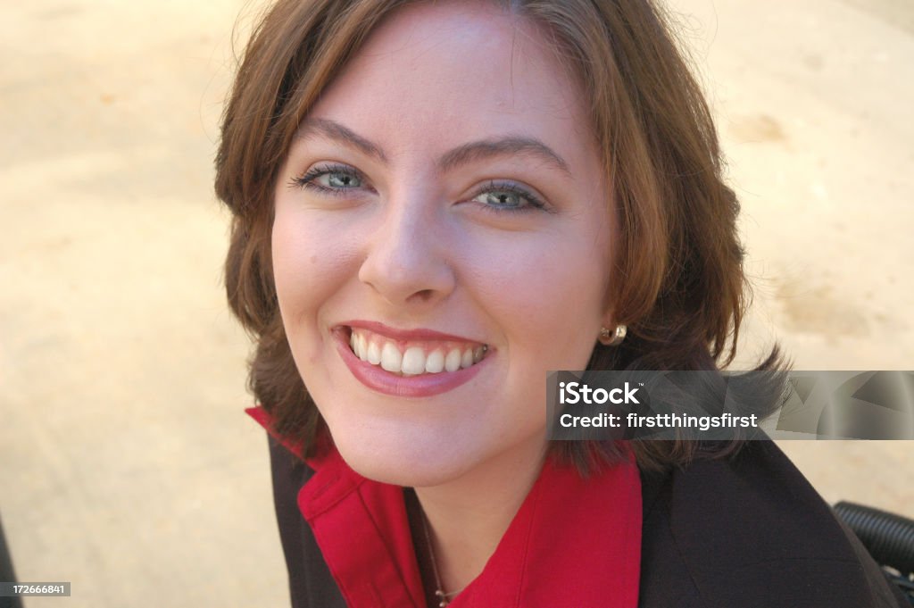 Smiling Business Woman head shot of a woman in a suit Adult Stock Photo