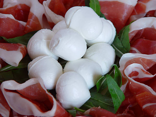 Ham and Mozzarella Cheese with fresh Arugula Leaves detail on mozzarella cheese with ham baloney photos stock pictures, royalty-free photos & images