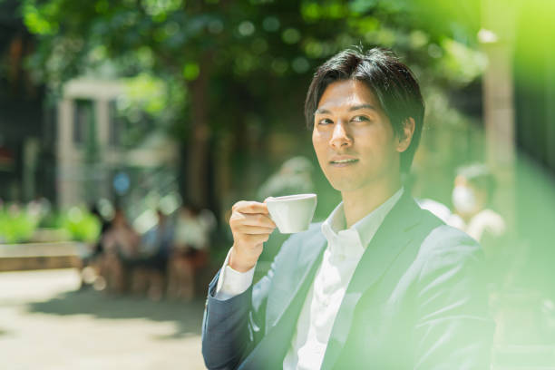 istock Young businessman drinking coffee at a cafe 1726673706