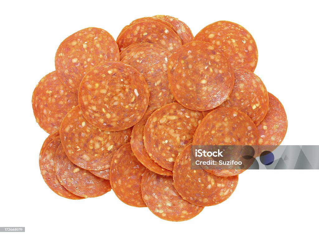 pepperoni "A pile of pepperoni, isolated on white. Part of my sandwich ingredients series." Pepperoni Stock Photo