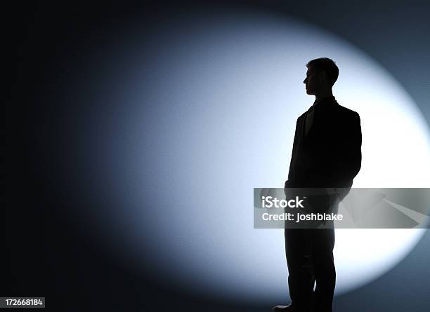 Businessman Silhouetted In A Spotlight Stock Photo - Download Image Now - Spot Lit, People, In Silhouette