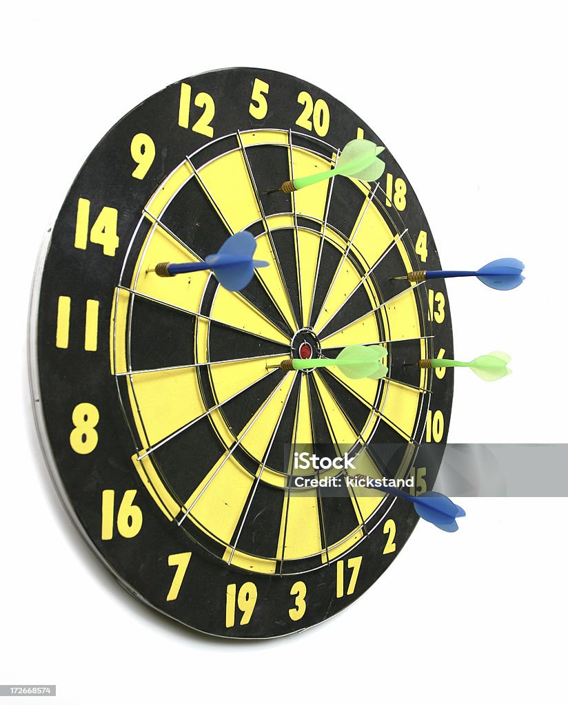 Dartboard "Dartboard with three blue darts and three green darts in it. No clipping path, sorry.View others in my" Dartboard Stock Photo