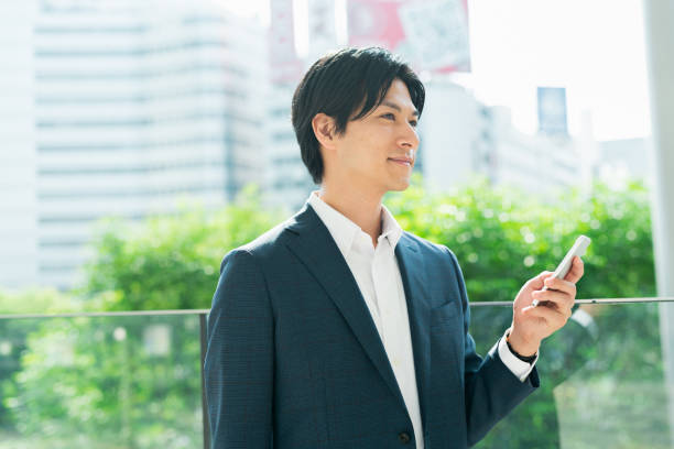 istock Young businessman looking at his smartphone at a train station 1726687248