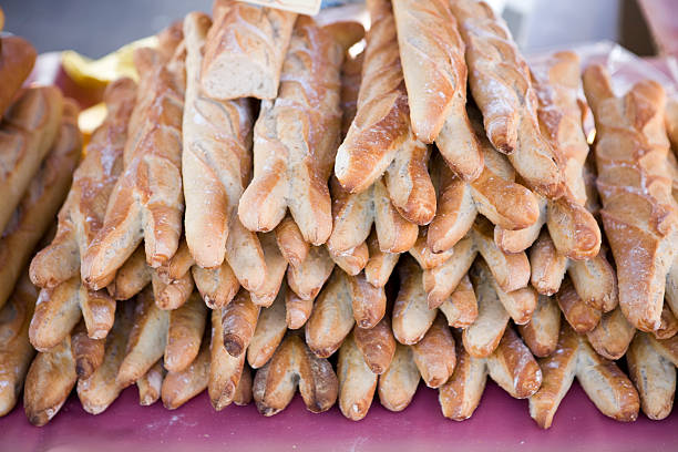Baguettes stacked high at a French farmers market