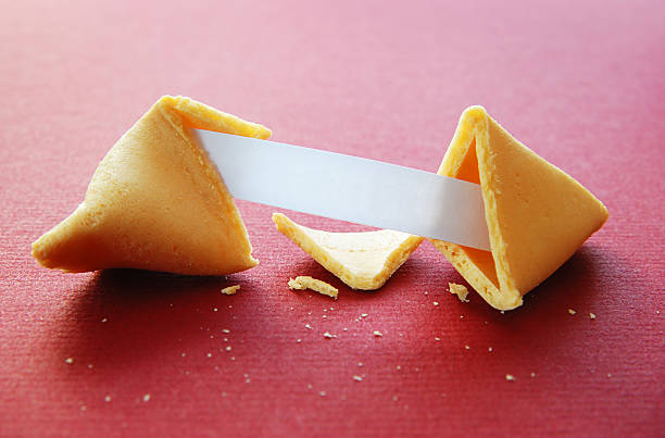 Open fortune cookie with blank fortune stock photo