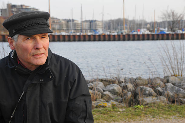 istock Senior man in front of marina with canal 172669210
