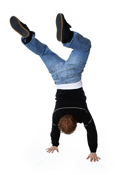 Hand Stand Young man performing a hand stand. handspring stock pictures, royalty-free photos & images