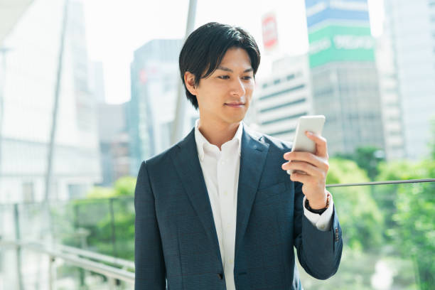 istock Young businessman looking at his smartphone at a train station 1726696830