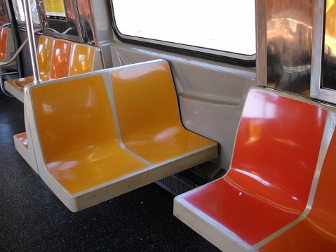 Empty subway seats.