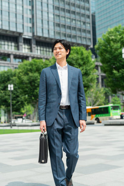 istock Young businessman commuting through a building district 1726701735
