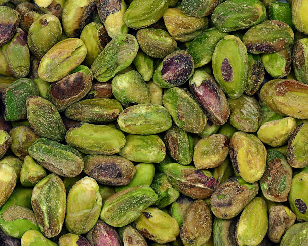 pistachios Shelled unsalted pistachios. Pistachio stock pictures, royalty-free photos & images