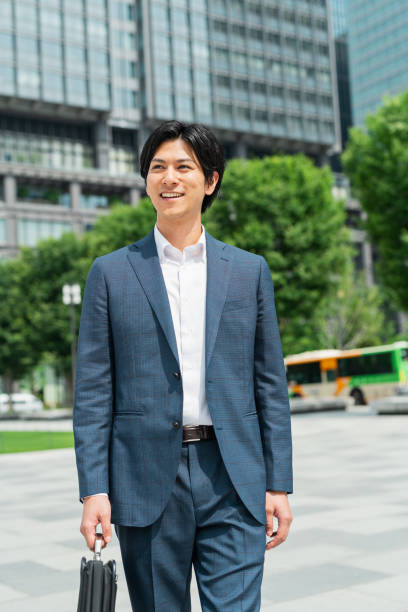 istock Young businessman commuting through a building district 1726703860