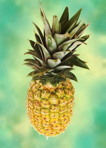 a pineapple against a colorful background