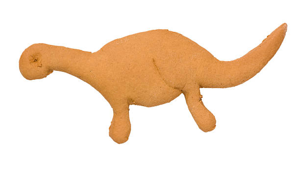 Gingerbread dinosaur cookie stock photo