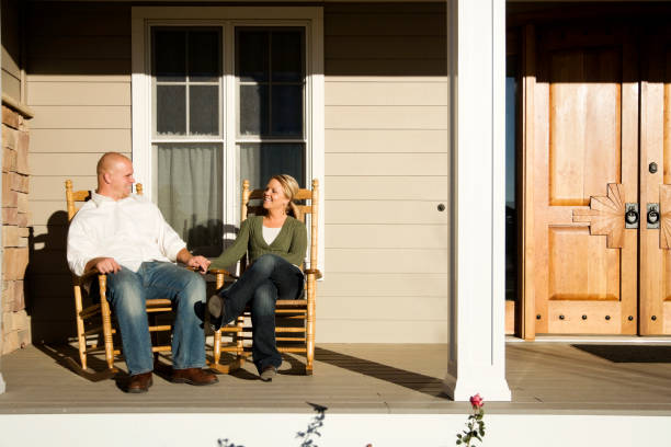 istock Young Married Couple Sitting on Front Porch 172671194