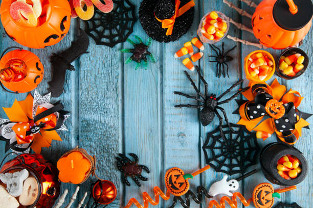 istock Halloween party decorations frame on blue wooden rustic table 1726712760