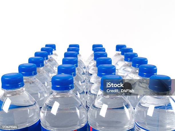 Case Of Filled Water Bottles With Blue Caps Stock Photo - Download Image Now - Water Bottle, Arrangement, Blue