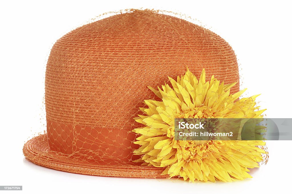 Orange Hat orange hat with a yellow flower isolated on white Color Image Stock Photo
