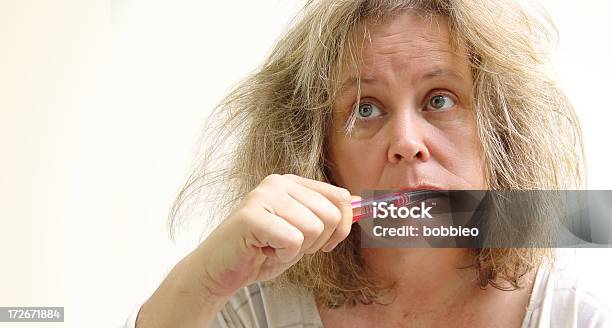 Woman Brushing Her Teeth Stock Photo - Download Image Now - Messy, Morning, Pajamas