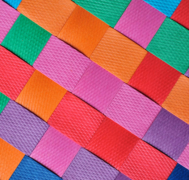 Diagonal Brights Bright woven basket pattern background. woven place mat multi colored checked stock pictures, royalty-free photos & images