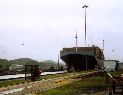 A boatcrosing the panama channel from behind