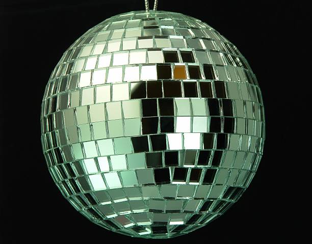 Disco Ball Closeup of a disco ball on a black background. partytime stock pictures, royalty-free photos & images