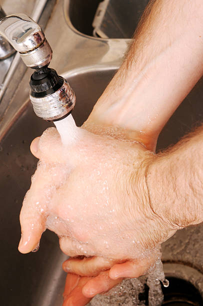 istock Washing Hands in the Kitchen Sink 172673450