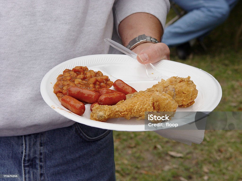 picnic food "Snapshot of man holding picnic plate.  Its not amazing photography, but its tack-sharp in focus and might be nice when describing company/church picnics to use as background/sidebar image." Bean Stock Photo