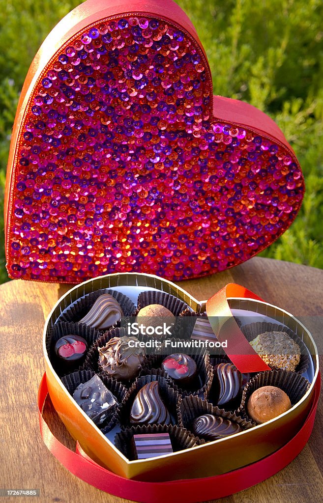 Belgian Chocolate Valentine's Day Holiday Candy Truffles, Heart Gift Box "Belgian chocolates in a bright gift box. (SEE LIGHTBOXES BELOW for more in this series, as well as more chocolates, Valentine's, and holiday food & cooking photos...)" Beauty Stock Photo