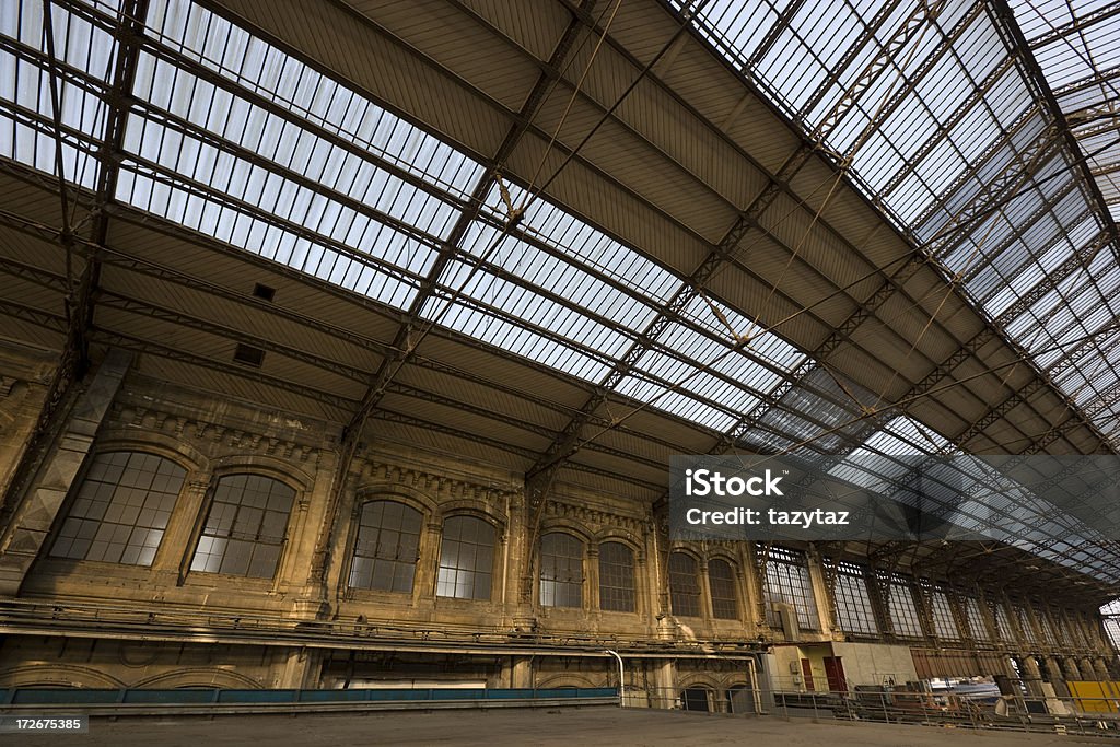 Sky-lit Warehouse Old warehouse in the upper level of a train station in Europe. Abandoned Stock Photo