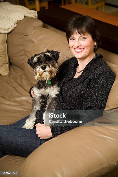 Adult Woman And Her Puppy Stock Photo - Download Image Now - 40-49 Years, Adult, Adults Only