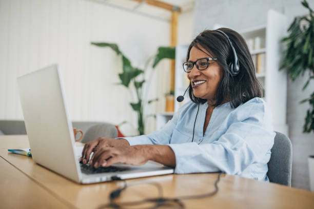 istock Modern mature woman using laptop 1726764496