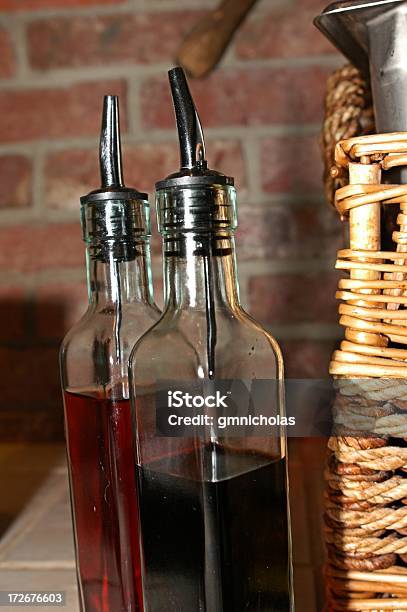 Bottles Of Oil And Vinegar Stock Photo - Download Image Now - Balsamic Vinegar, Basket, Bottle