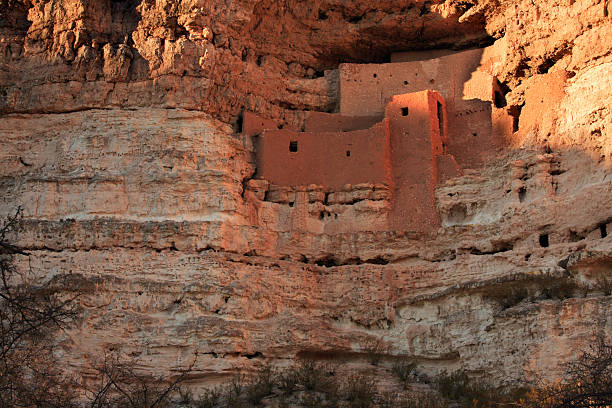 Ancient Indian Pueblo built into cliffs Ancient Indian ruin built by the Sinagua Indians hundreds of years ago. This is at Montezuma Castle National Monument located in Arizona near Sedona. anasazi stock pictures, royalty-free photos & images