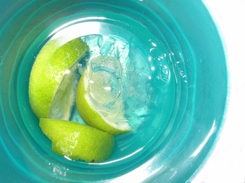 Drink with lime. (It is a Gin & Tonic but could pass as water or soda).