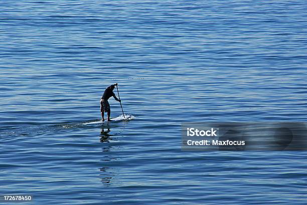 Surfboard Paddling Stock Photo - Download Image Now - Beach, Blue, Exercising