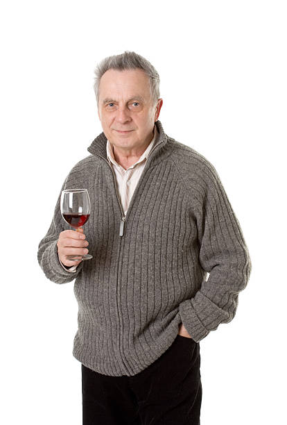 istock mature man with glass of red wine 172678509