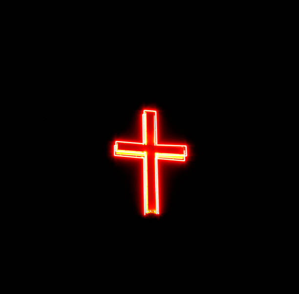 istock Red And Yellow Illuminated Cross On Black 172679209