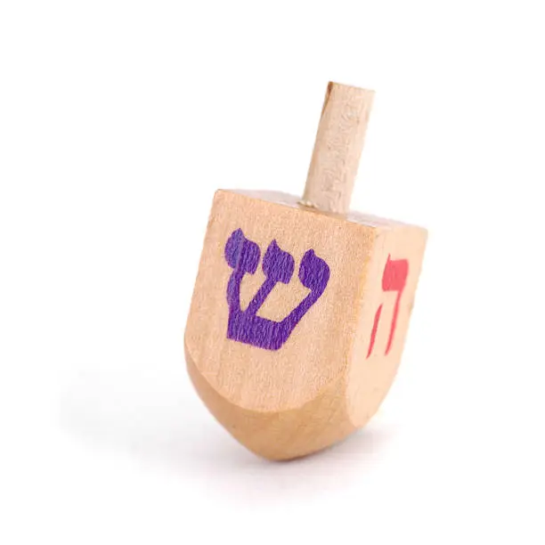 "A close-up of a dreidel, isolated on whiteAlso available:"