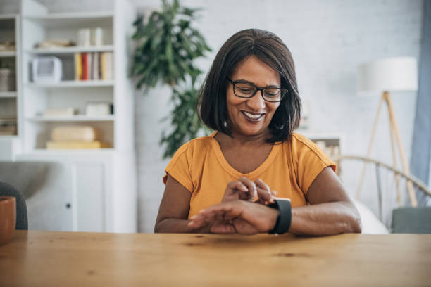 istock Mature woman checking smart watch 1726799432