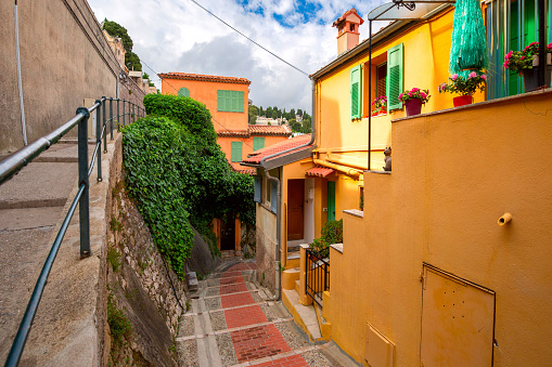 Colorful cosy street and houses in the Old Town of Menton, French Riviera, France